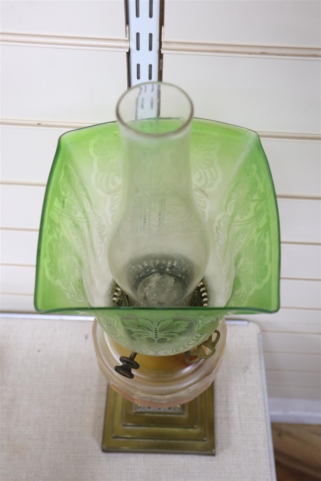 An Edwardian brass and glass oil lamp